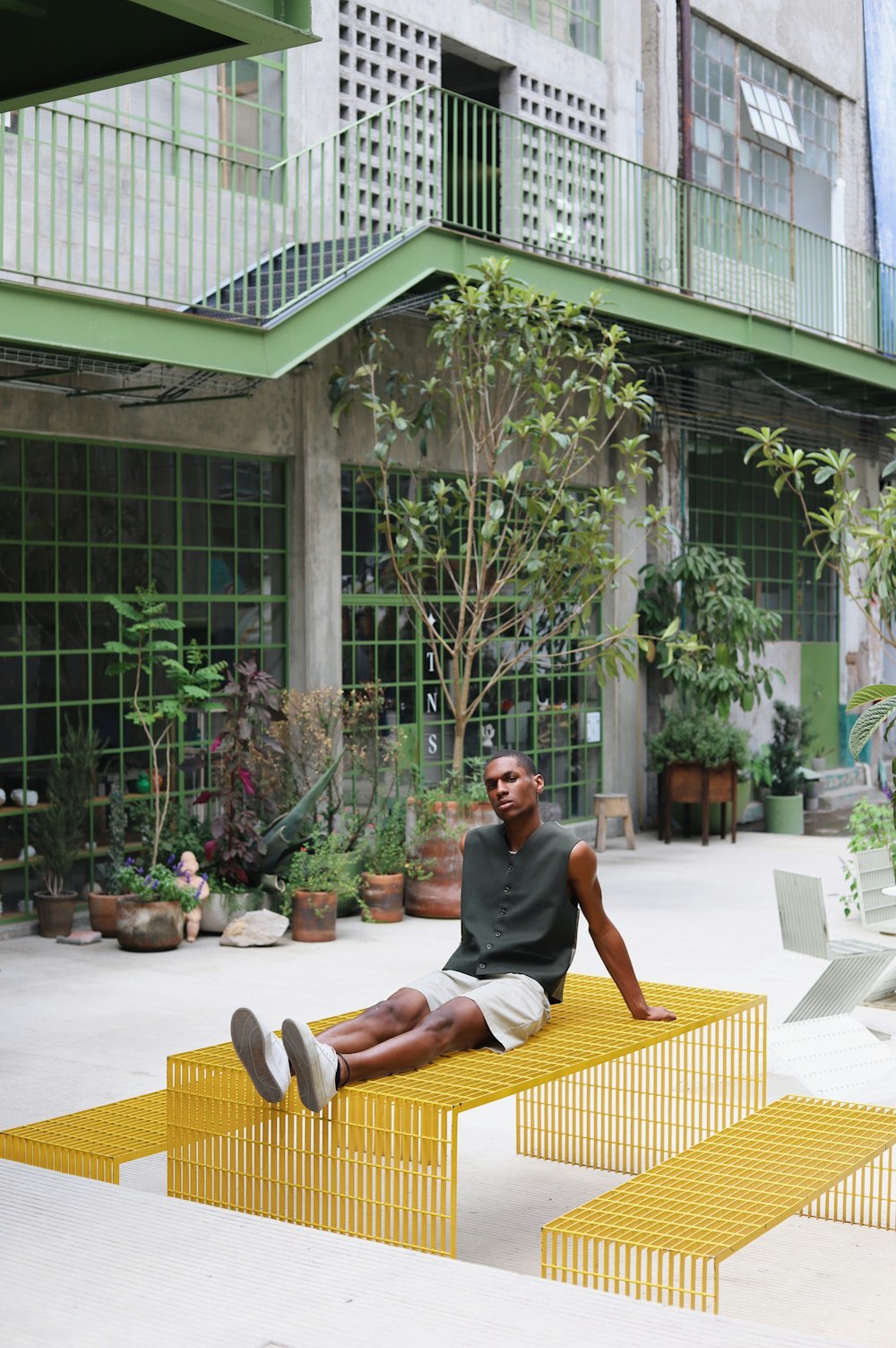 a person sitting on a chair outside