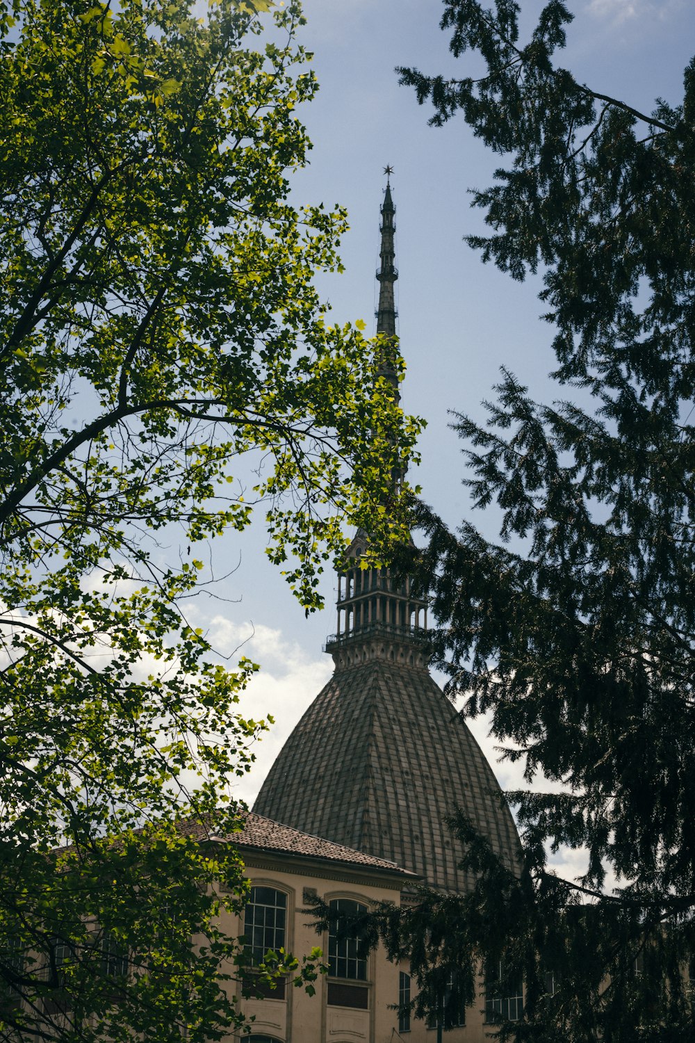 a tall building with a pointed roof