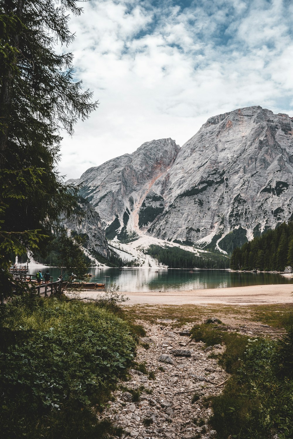 a lake with mountains in the background