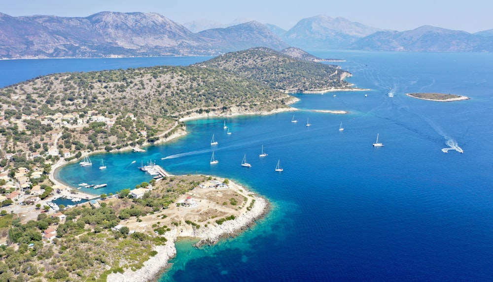 a body of water with boats in it and land around it