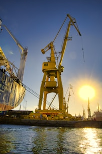 a group of cranes on a dock