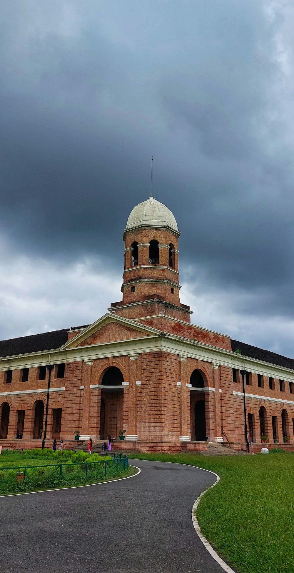 a large brick building with a domed roof