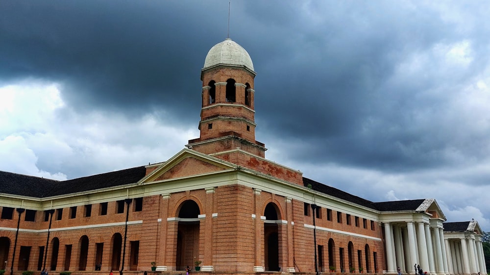 a large brick building with a domed roof