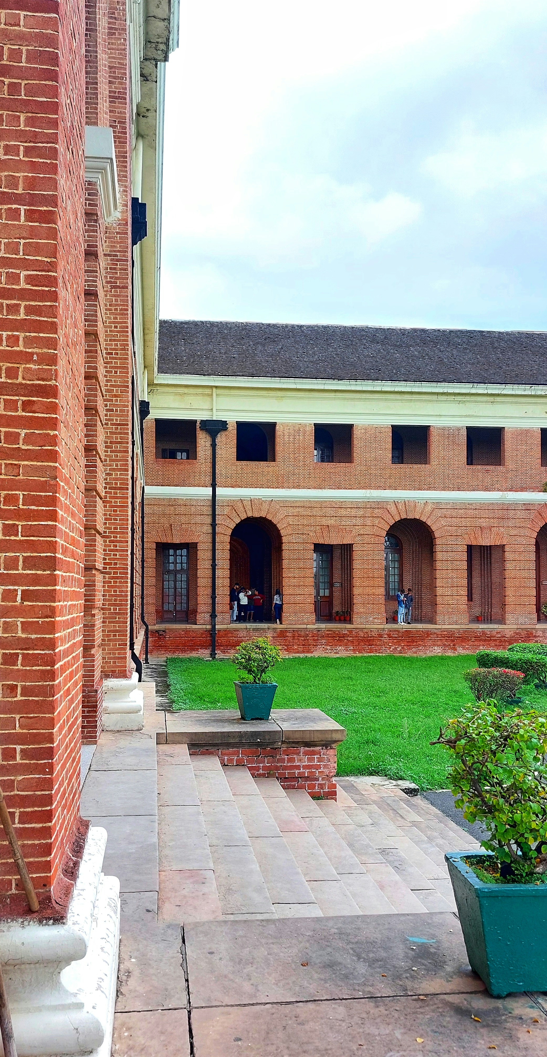 A brick building with a courtyard photo – Free Forest research ...
