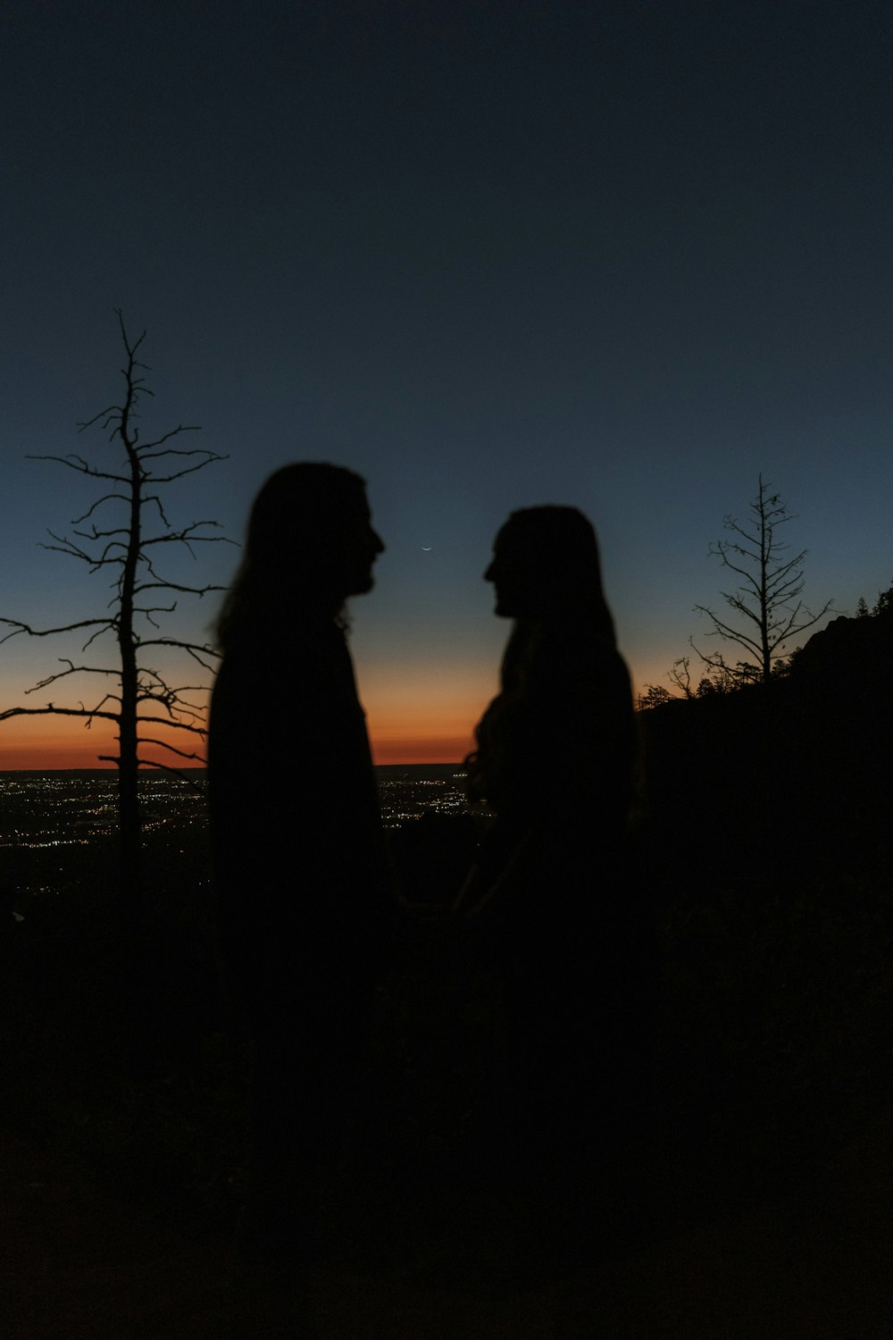two people looking at the sunset
