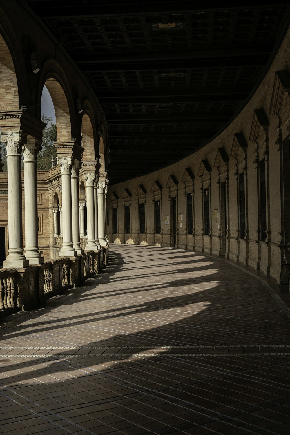 a brick walkway with pillars