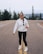 a person standing on a road