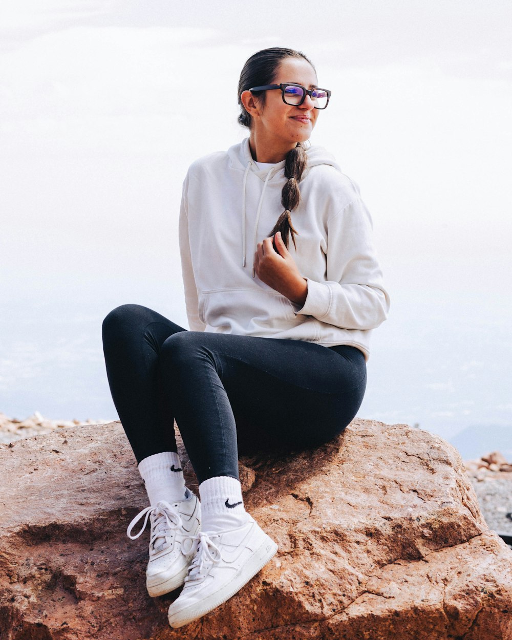 a person sitting on a rock