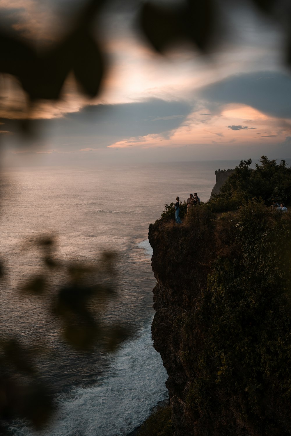 a cliff with a body of water below