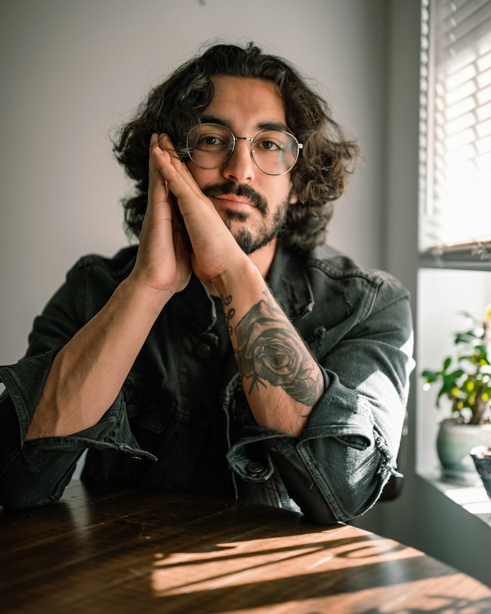 a man with a beard and glasses