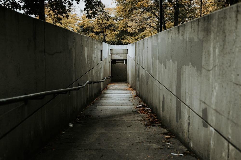 a concrete wall with a walkway