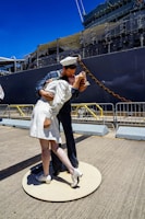 A romantic scene depicting the nurse and a soldier sharing a moment amidst the backdrop of war-torn France.