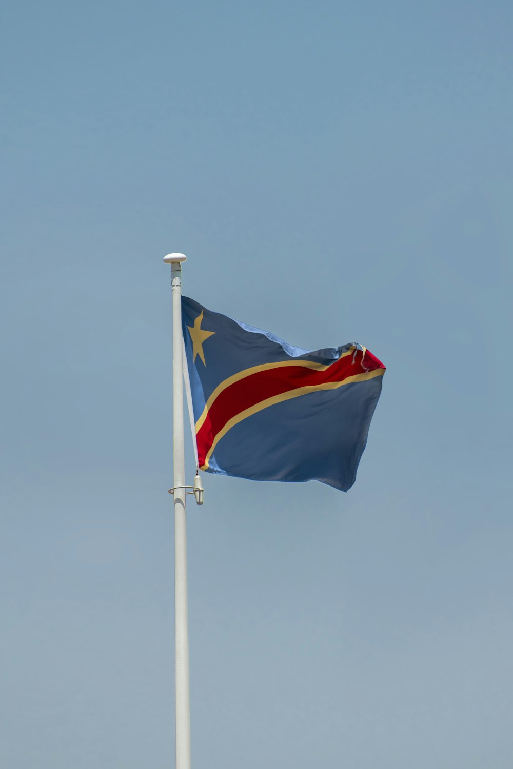 Un drapeau sur un poteau photo – Photo République démocratique du Congo  Gratuite sur Unsplash