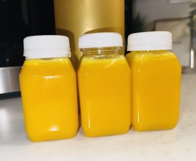 Bright yellow bottles of fortune cooking oil lined up in the store aisle.