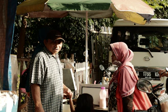 A professional consultant discussing Shariah-compliant investment options with clients.