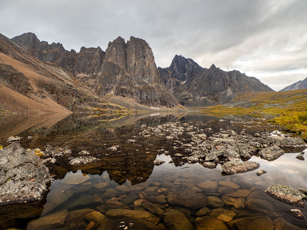 a river running through a valley between mountains