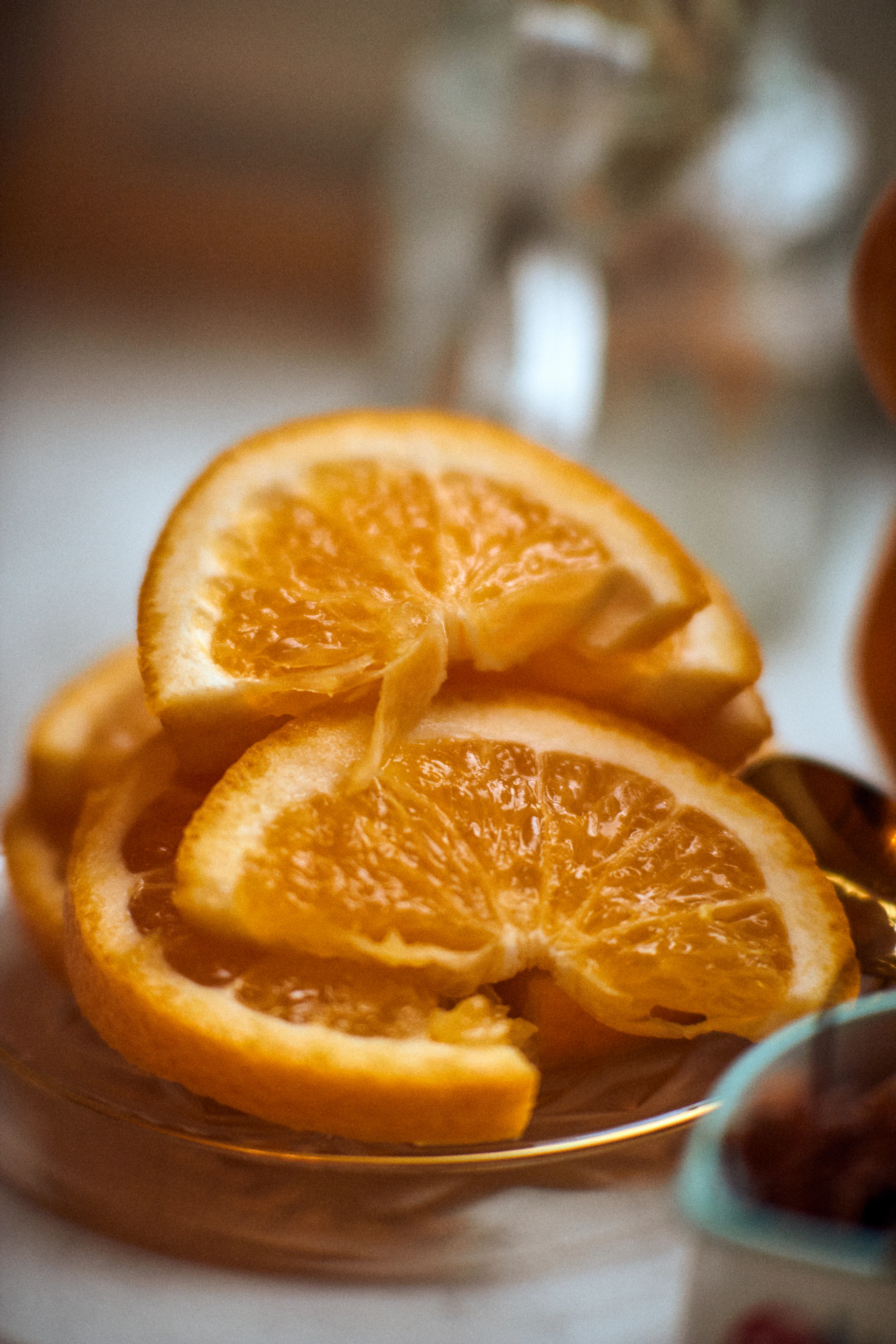 A modern kitchen scene with freshly sliced oranges arranged artfully on a sleek white plate, highlighting their juicy interior.