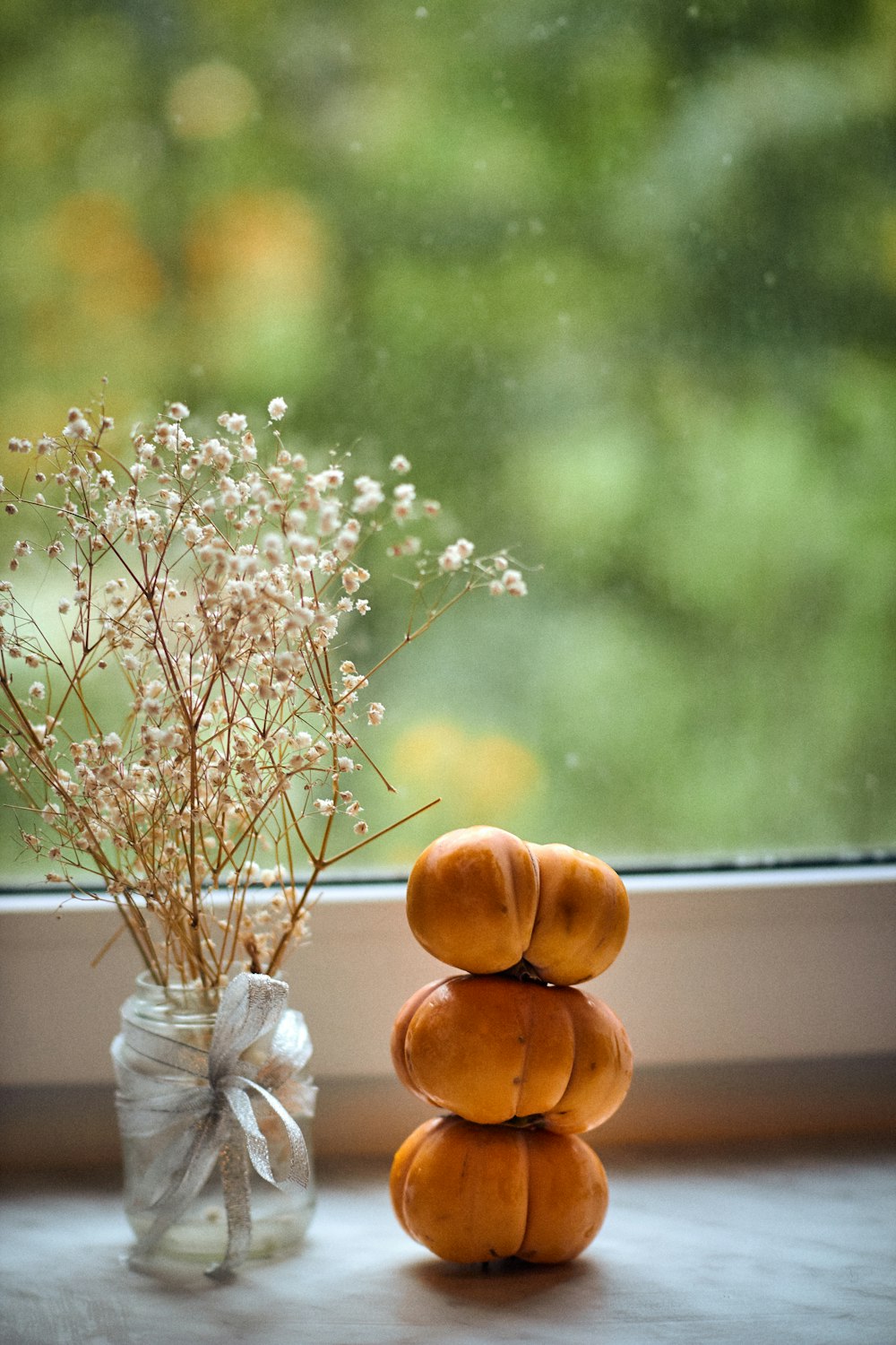 a vase with flowers next to a vase with flowers