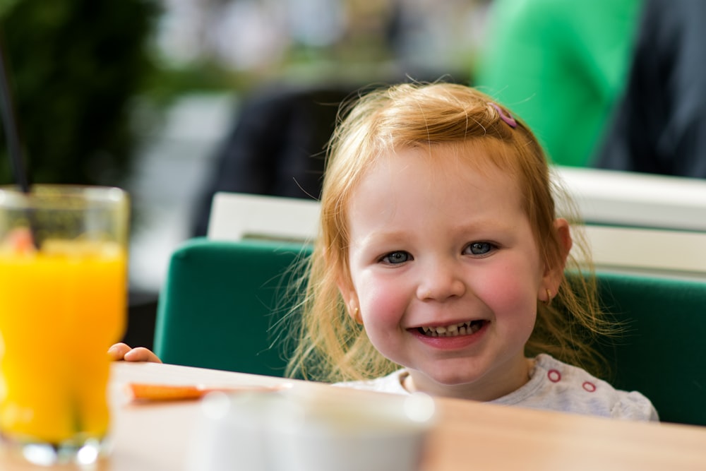 a child smiling at the camera