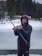 A happy customer holding a large fish caught during the ice-fishing trip.