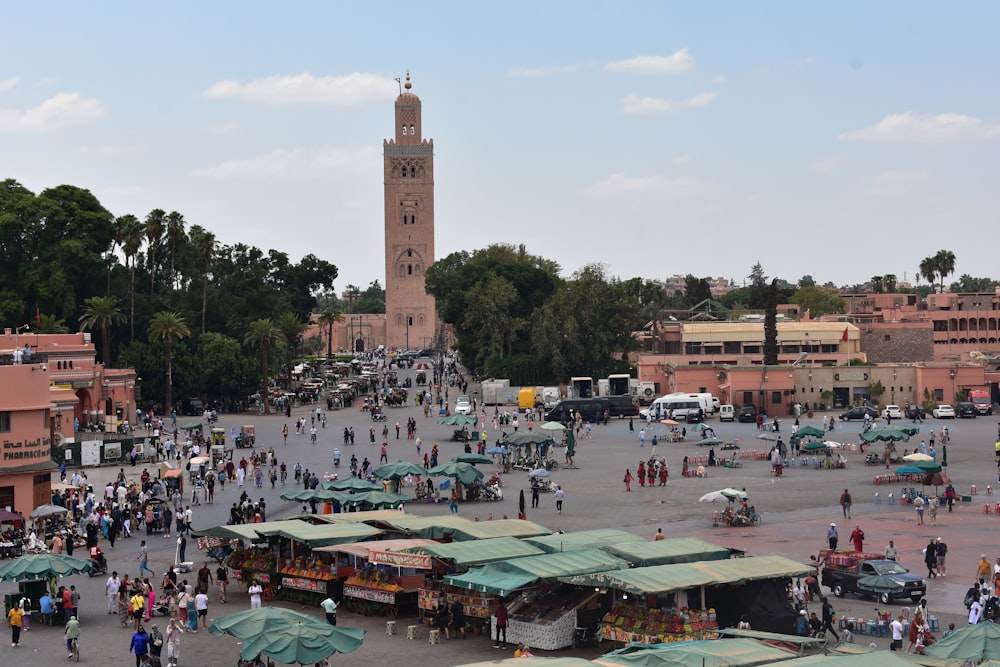 a large crowd of people in a city square