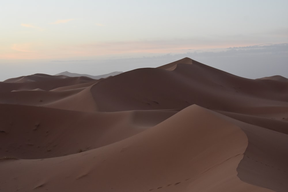 a desert landscape with sand dunes