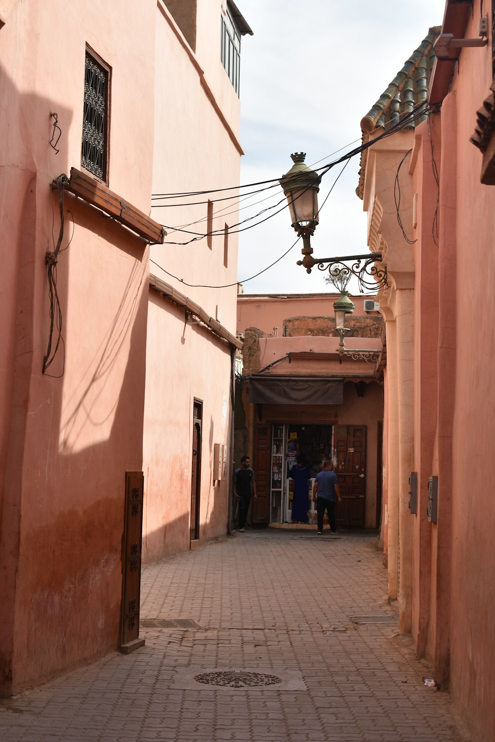 a cobblestone street between two buildings