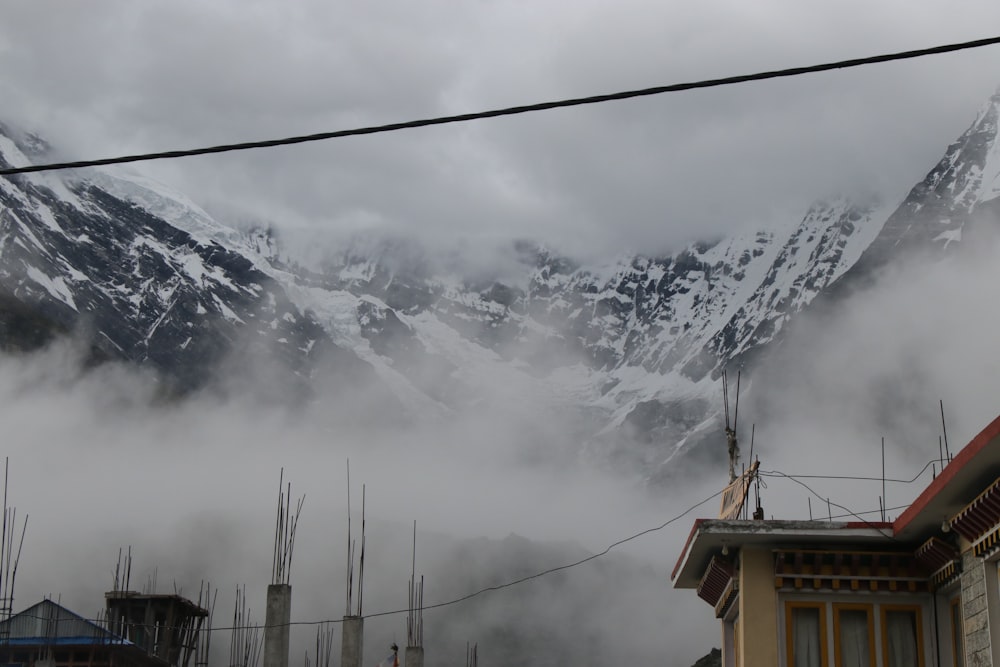 a snowy mountain with buildings