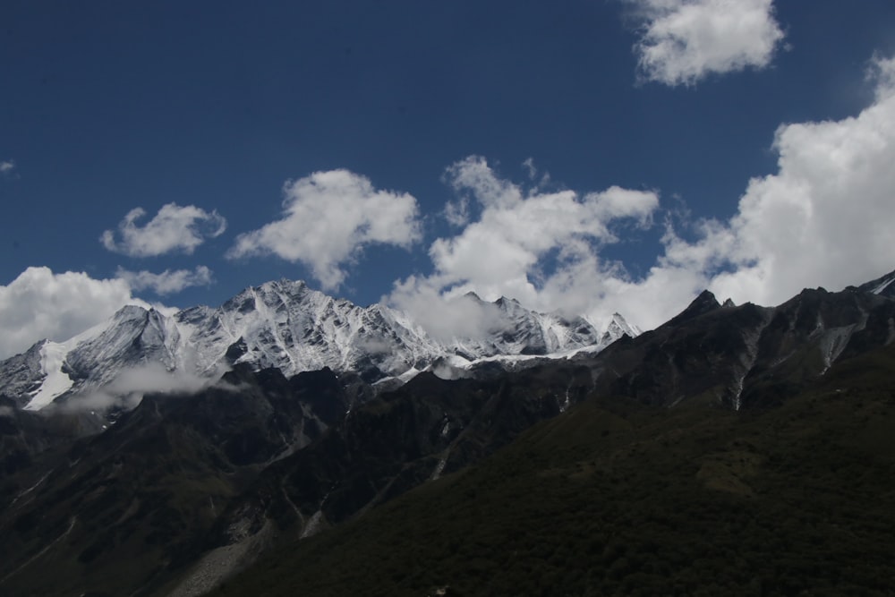 a mountain range with clouds