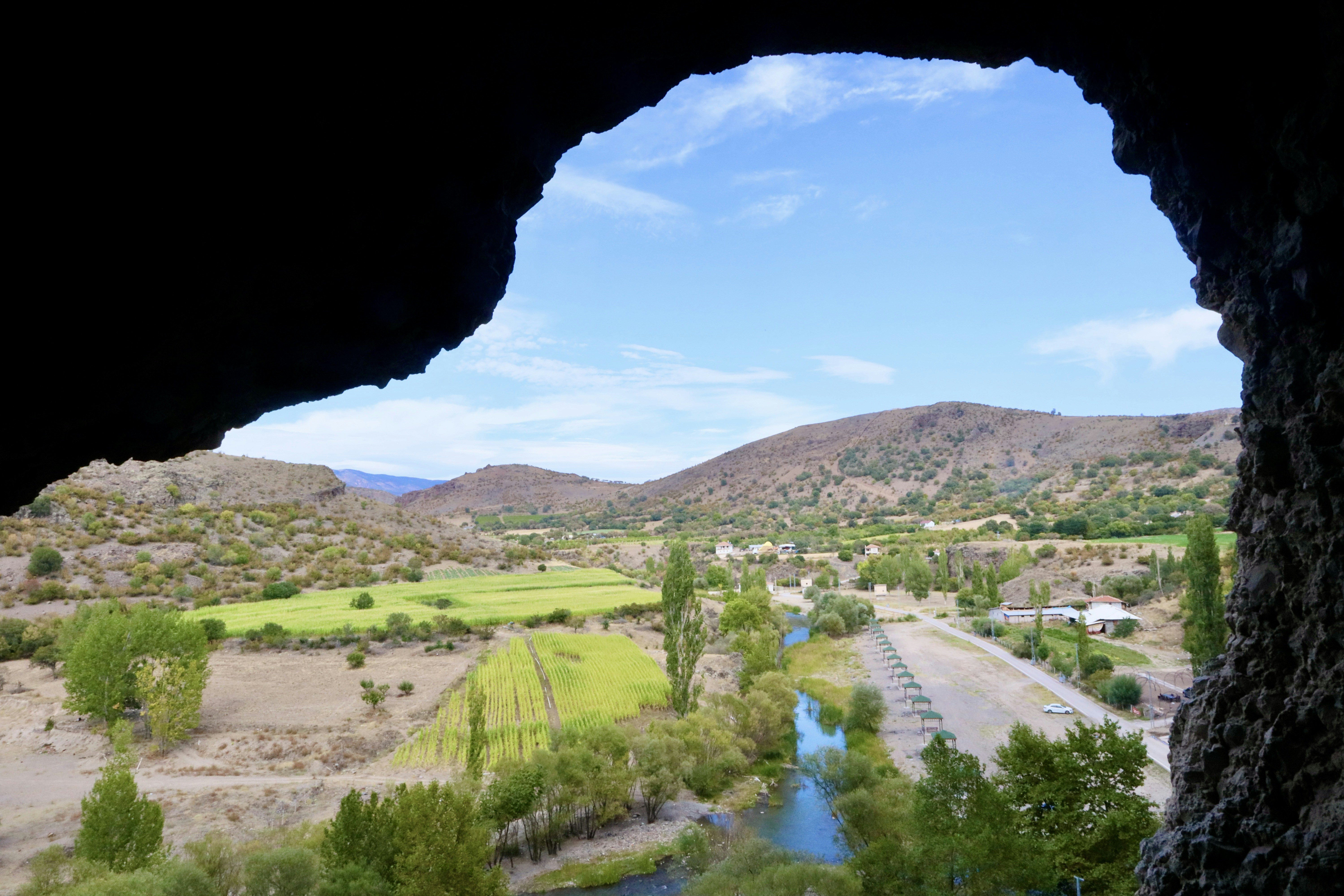 A view of a valley with a river running through it