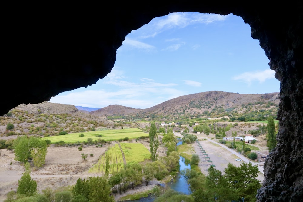 a view of a valley with a river running through it