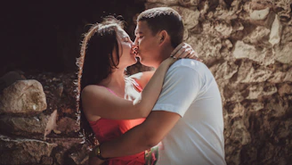 a man and woman kissing
