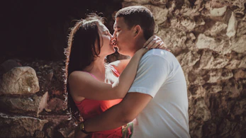 a man and woman kissing