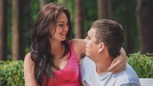 a man and woman kissing