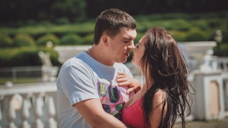 a man and woman kissing