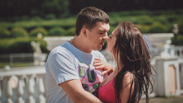a man and woman kissing