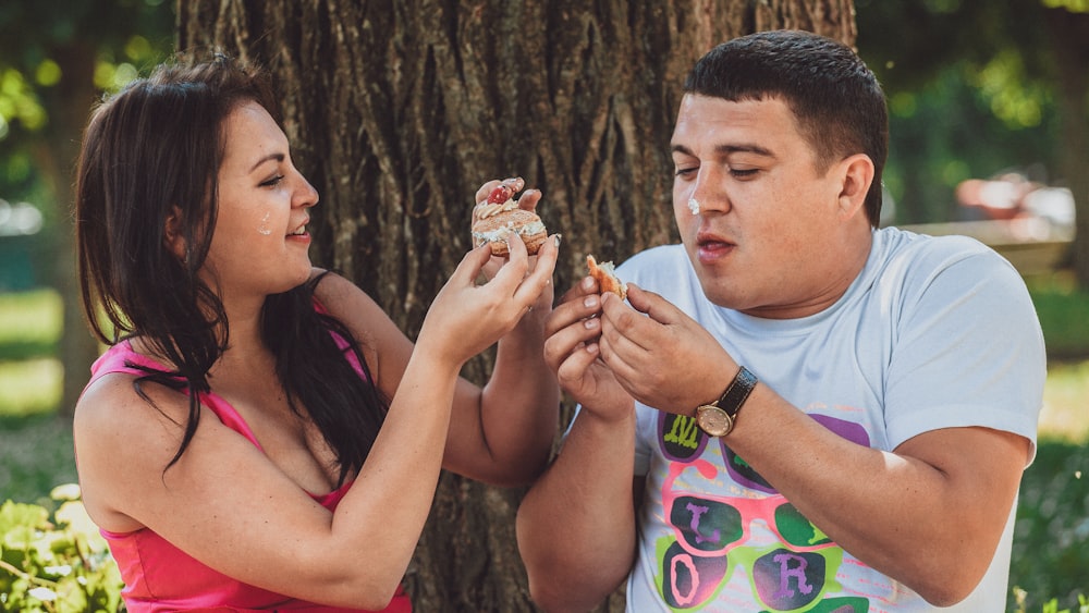 a man and a woman eating ice cream