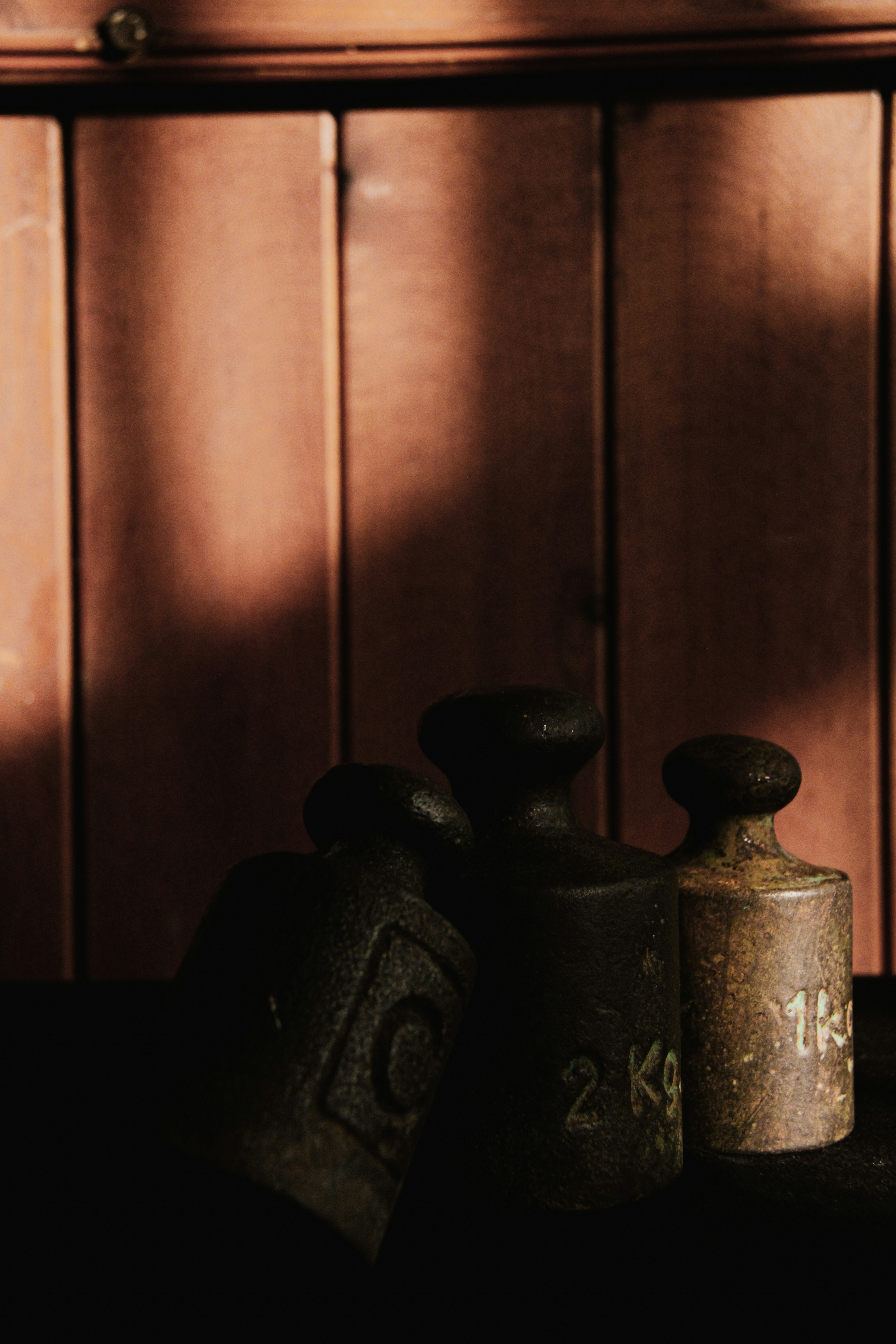 a couple of vases sit on a shelf