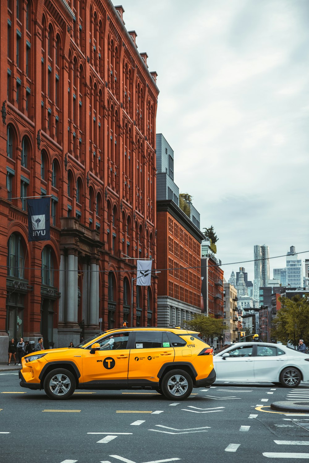 a yellow taxi on a street