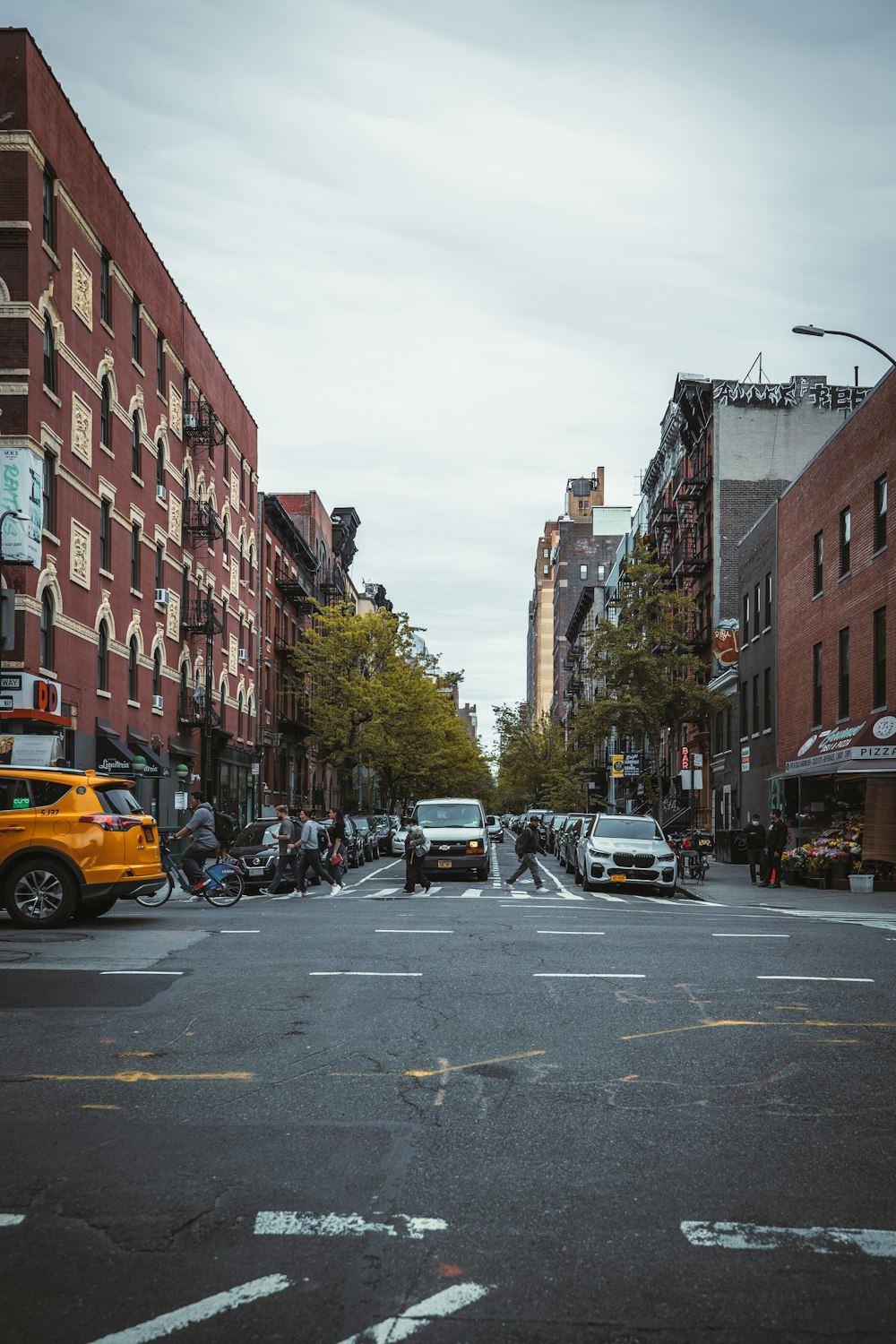 a busy street with cars and people