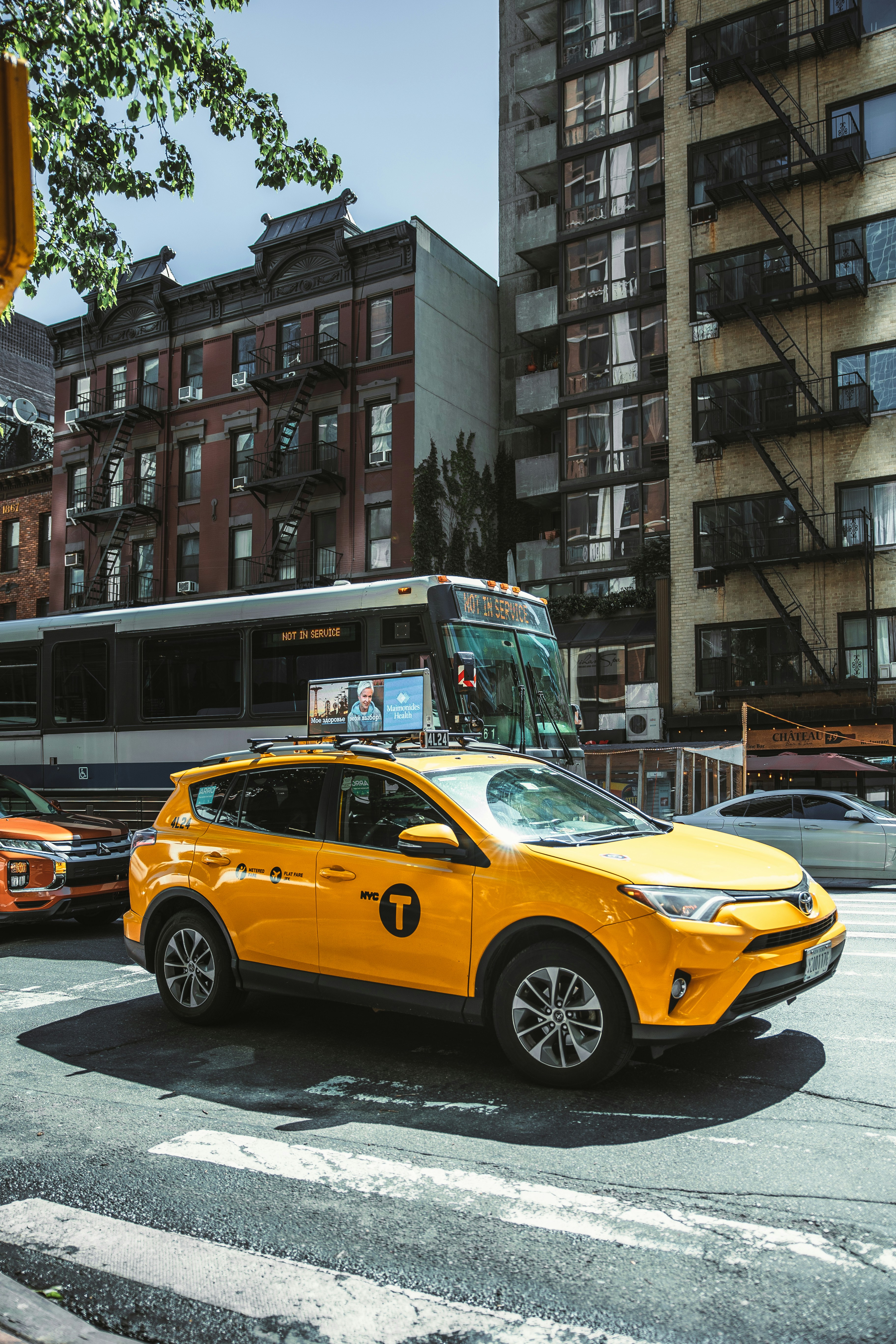 a yellow car on a street