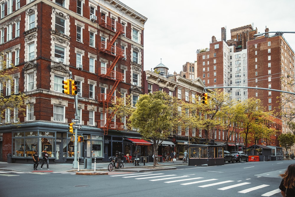 a city street with a few people and buildings