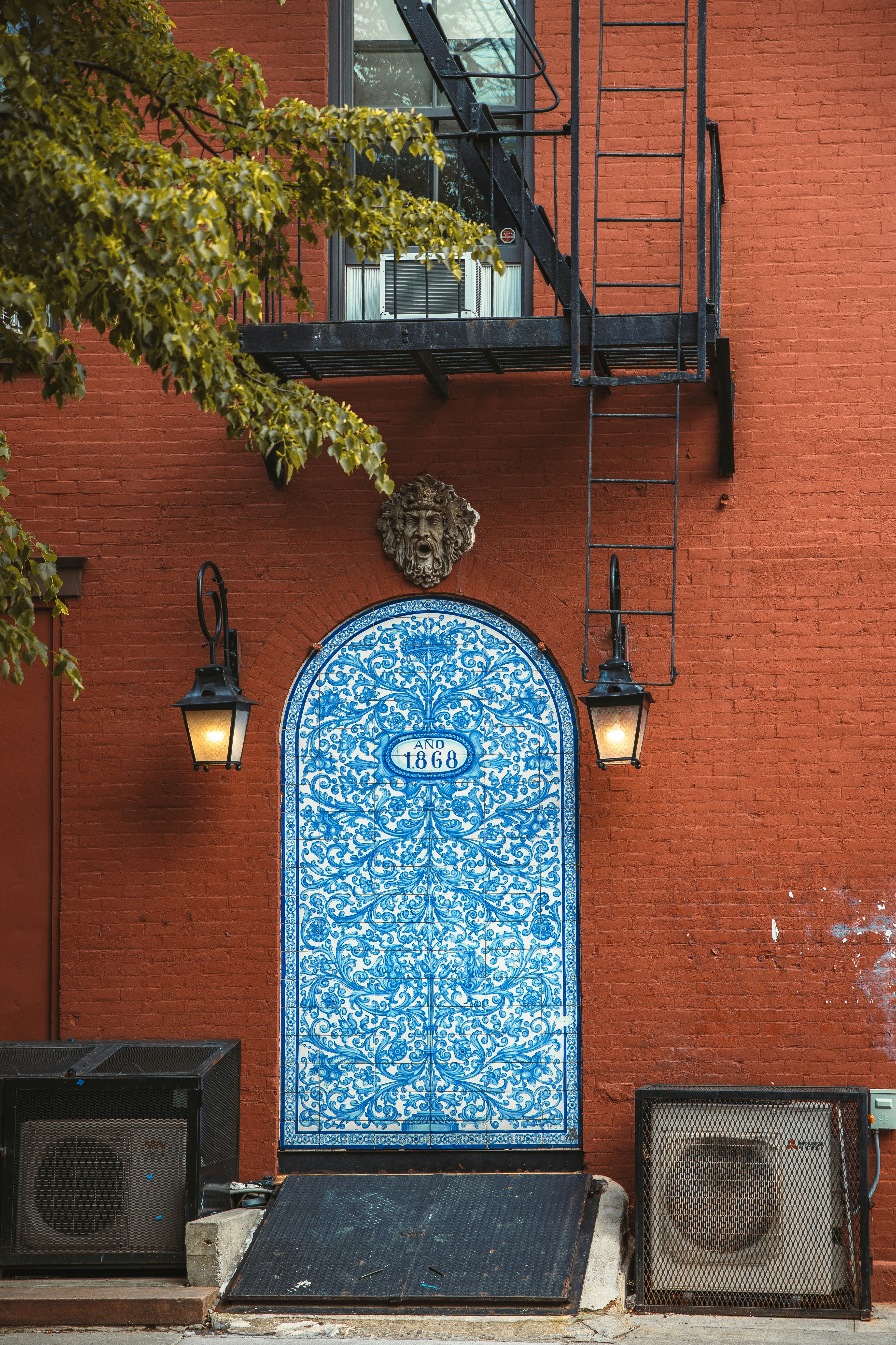 a blue door on a brick building