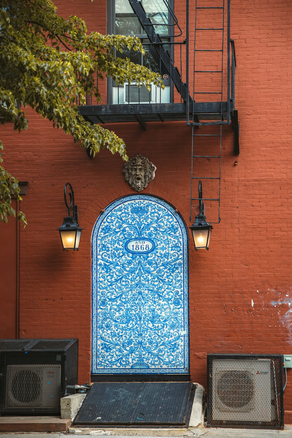 a blue door on a brick building