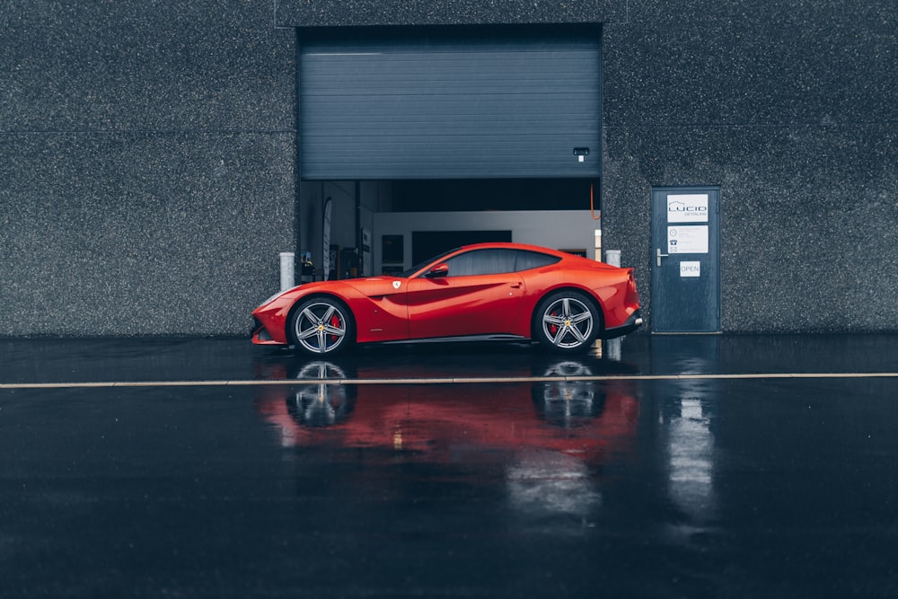 a red sports car parked in a garage