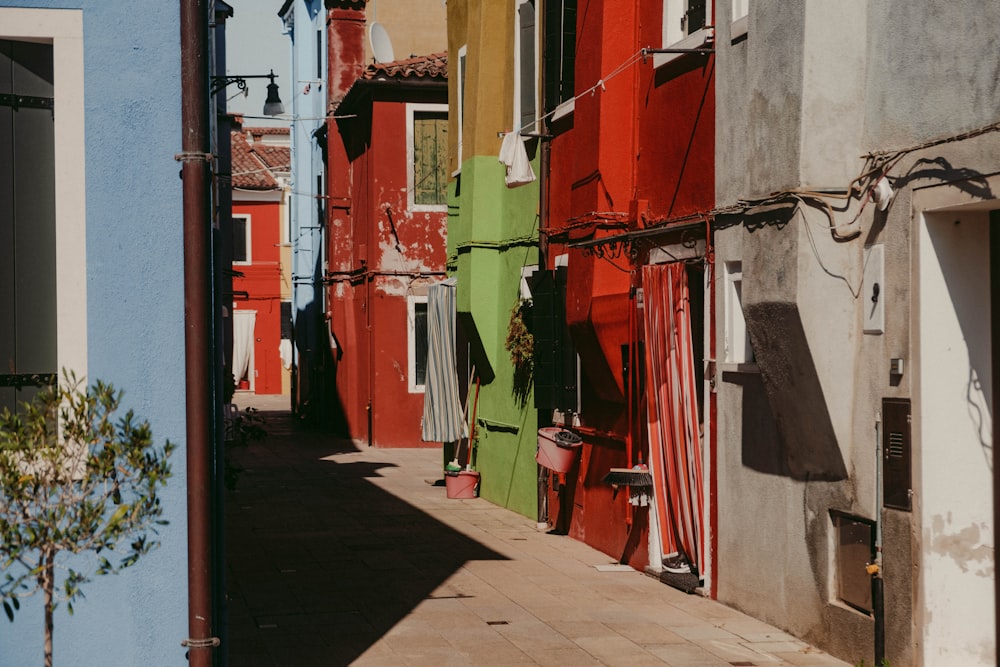 a row of buildings with red and white clothes from the outside