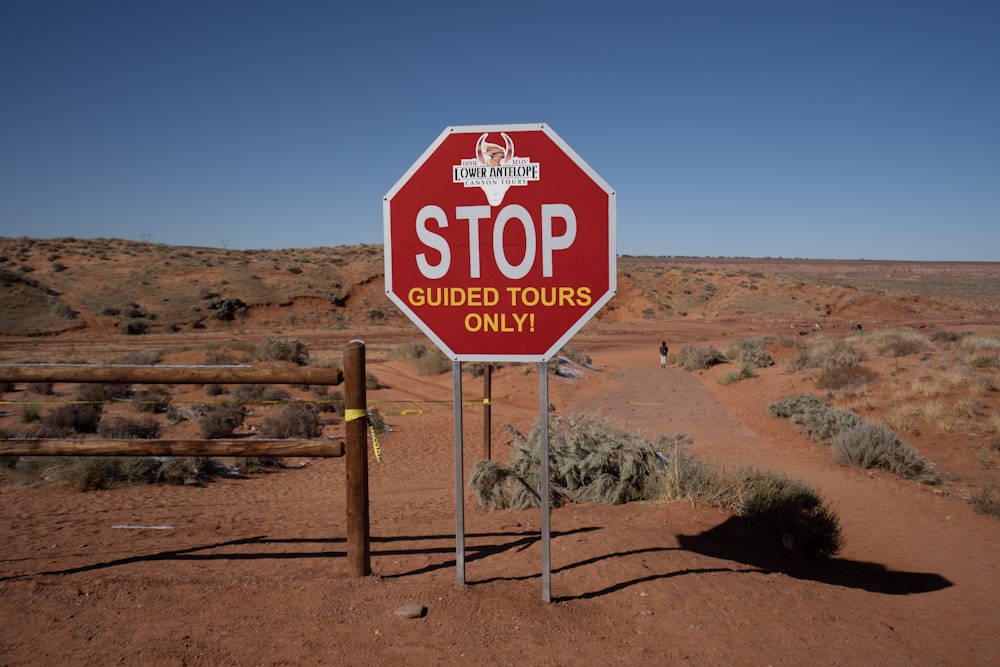 a stop sign in the desert