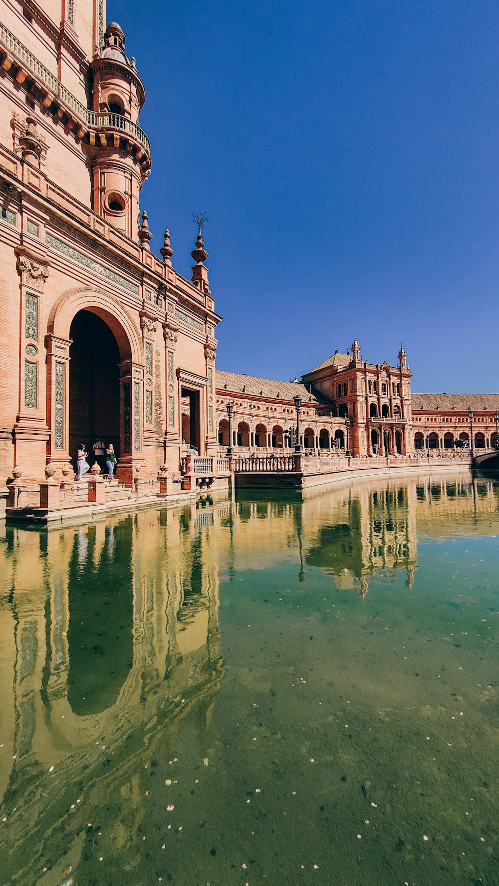 a building with a pool of water in front of it