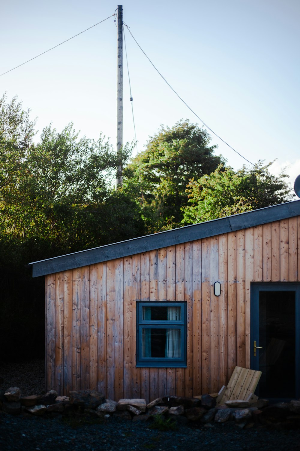 a wooden building with a blue door