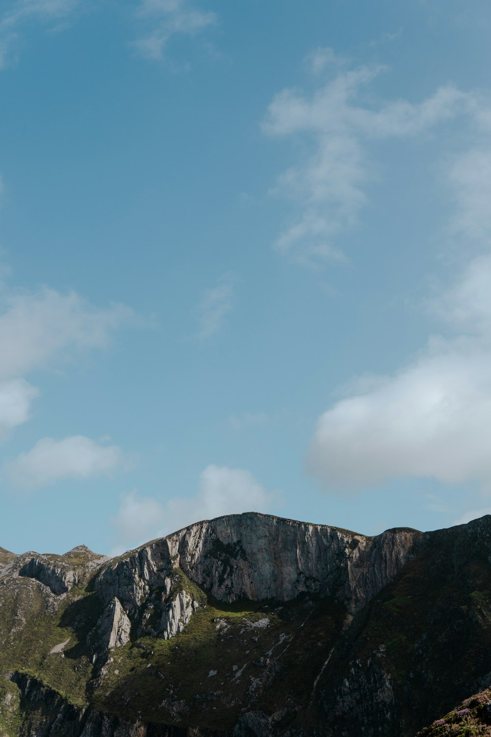 a mountain with a blue sky